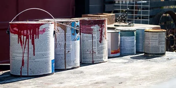 Used paint tins, fuels and solvents.