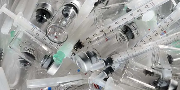 Medical waste, used syringes and medicine bottles